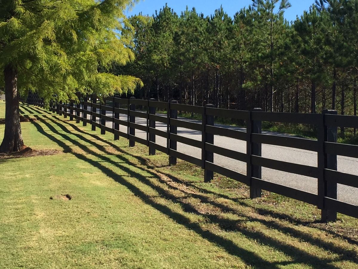 4 Rail Dark Stain 1 fence installed by Shelby Fence Company in Alabaster, AL