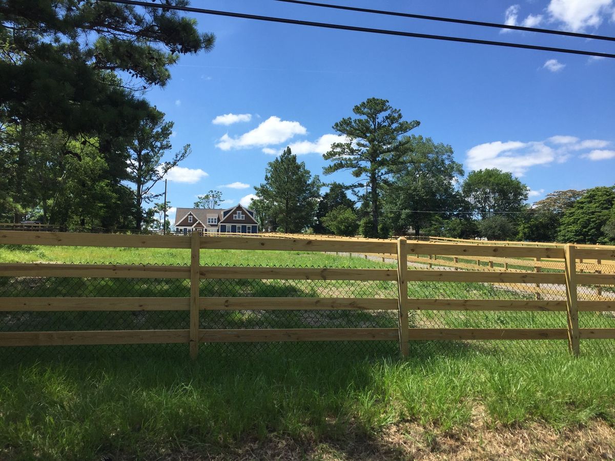 4 Rail With Black Vinyl 3 fence installed by Shelby Fence Company in Alabaster, AL